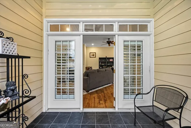 a view of front door of house and outdoor seating