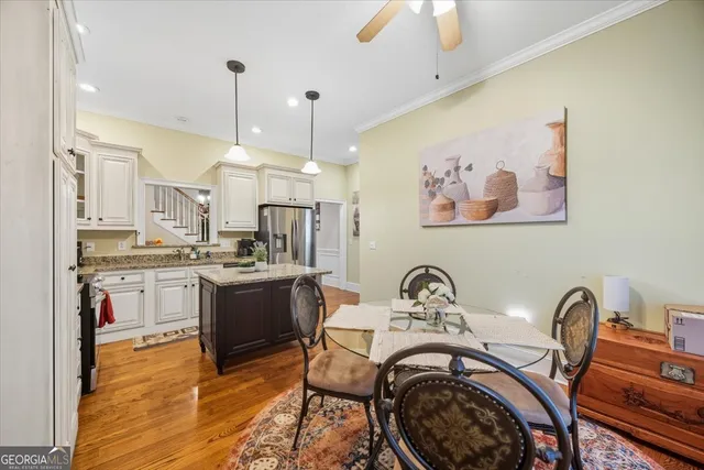 a view of a kitchen with a sink cabinets and wooden floor