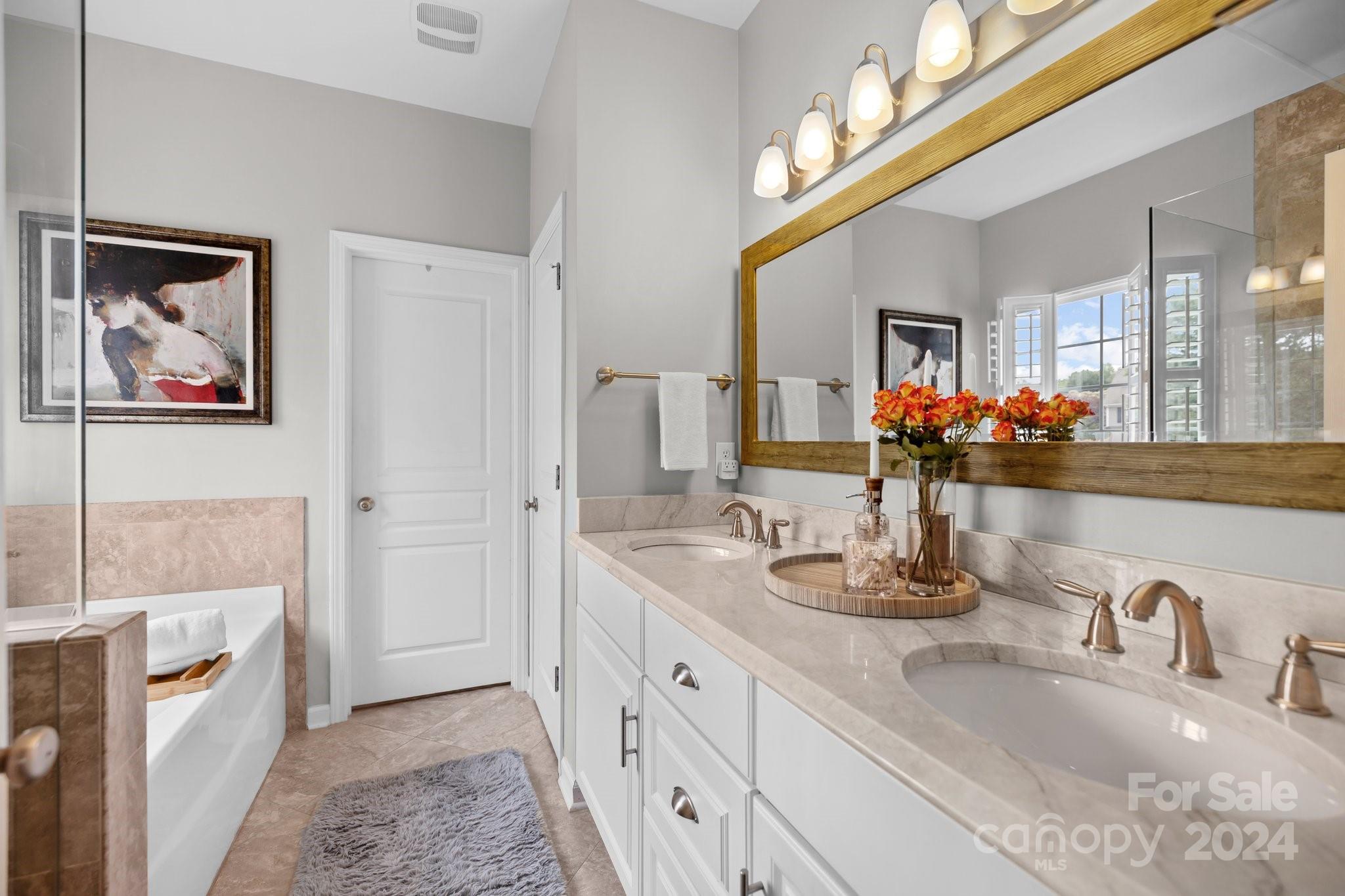 449 Silver Cypress Lane Fort Mill, SC 29708 - Photo 20 of 42 a bathroom with a double vanity sink and a mirror