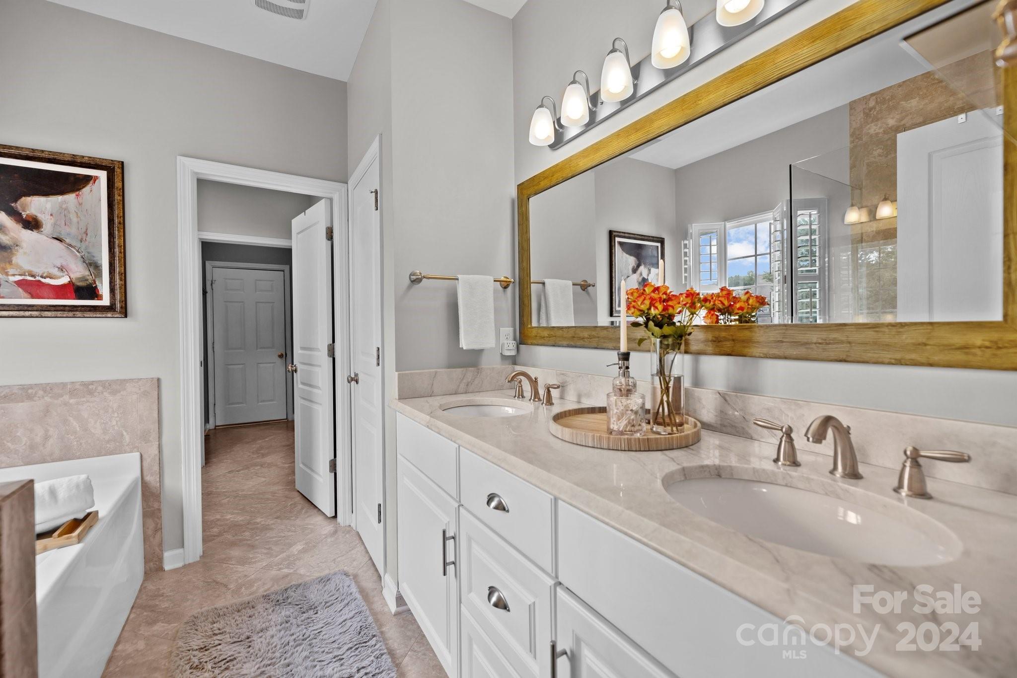 449 Silver Cypress Lane Fort Mill, SC 29708 - Photo 21 of 42 a bathroom with a double vanity sink and a mirror