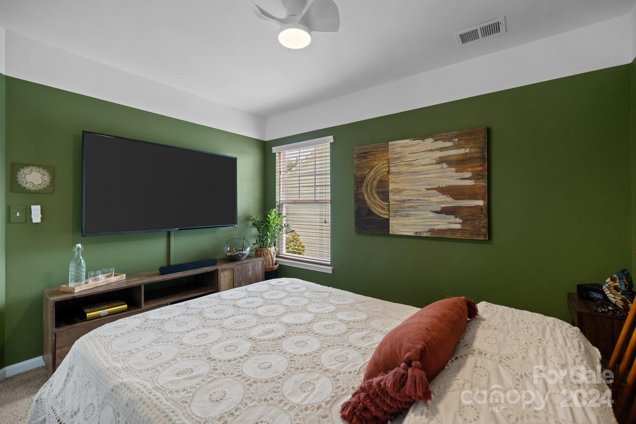 449 Silver Cypress Lane Fort Mill, SC 29708 - Photo 28 of 42 a bedroom with a bed and a flat screen tv
