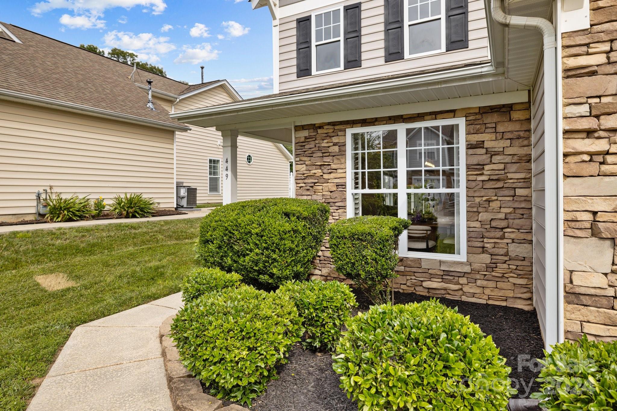 449 Silver Cypress Lane Fort Mill, SC 29708 - Photo 3 of 42 a view of a house with a garden