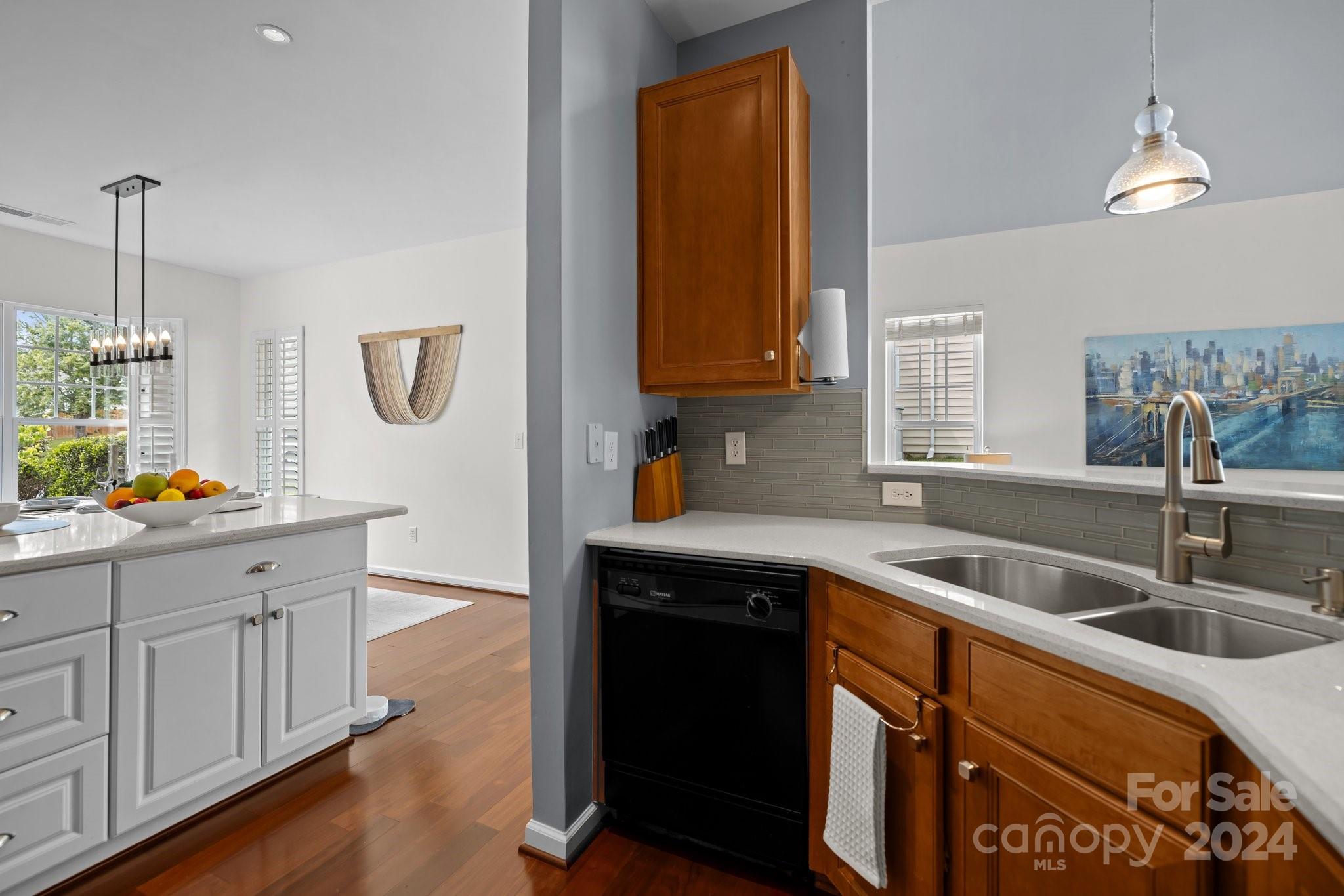 449 Silver Cypress Lane Fort Mill, SC 29708 - Photo 9 of 42 a kitchen with a sink and cabinets