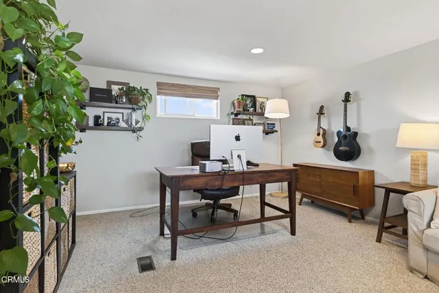 a view of a workspace with furniture
