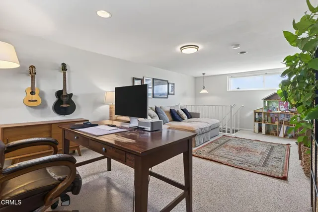 a living room with furniture and flat screen tv