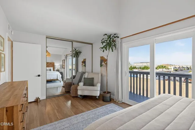 a bedroom with furniture and a window