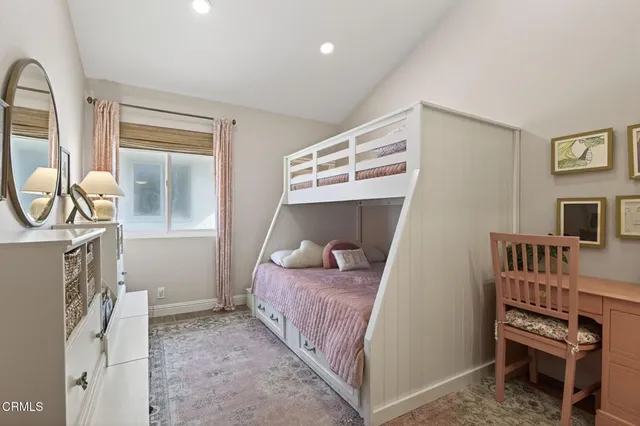 a bedroom with a bed and cabinets