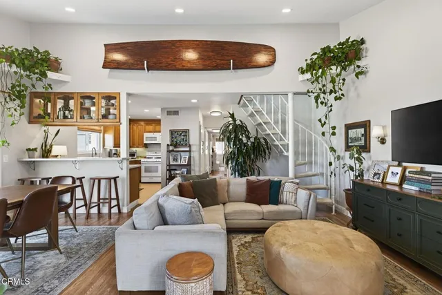 a balcony with wooden floor and outdoor space
