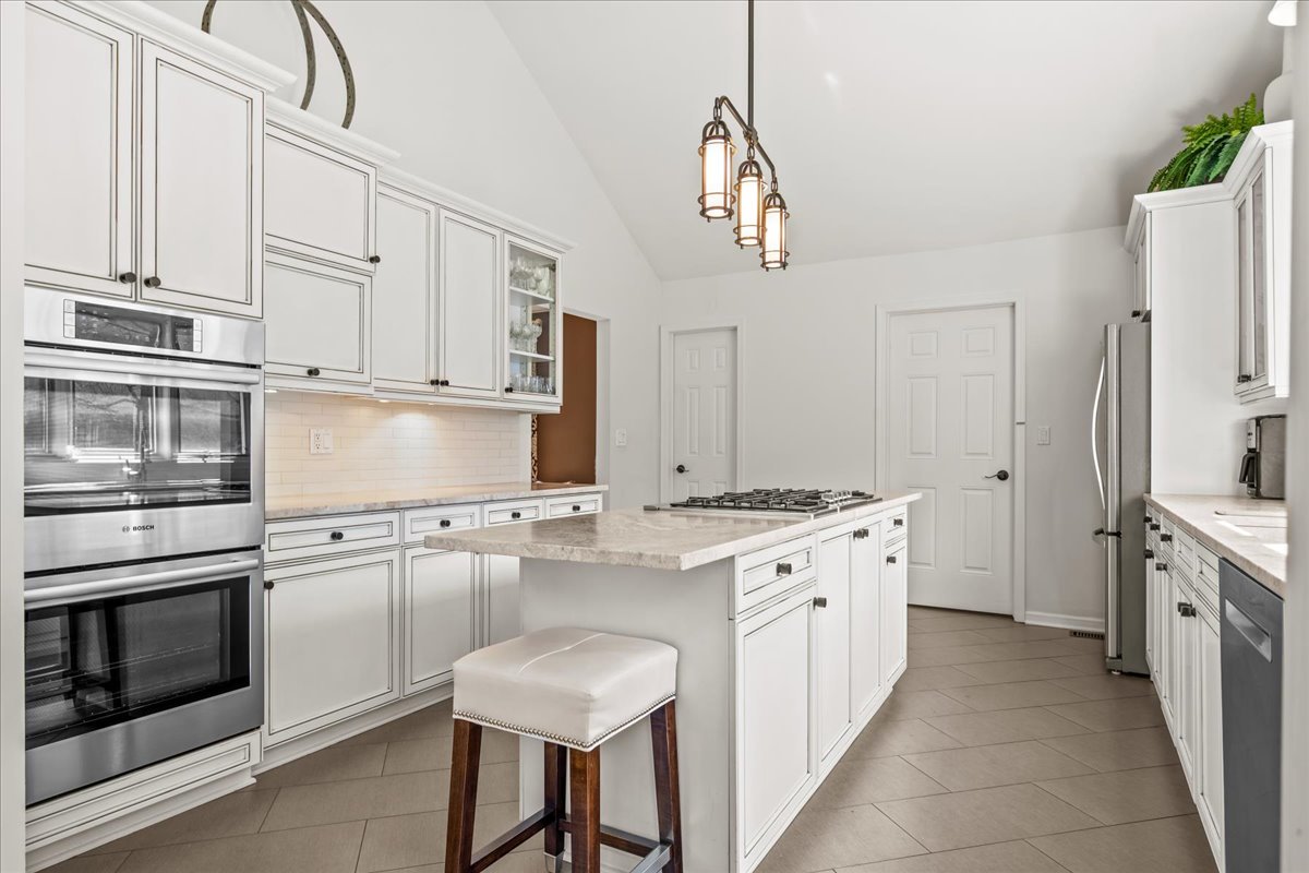 510 Buena Road Lake Forest, IL 60045 - Photo 11 of 40 a kitchen with stainless steel appliances a stove refrigerator sink and cabinets