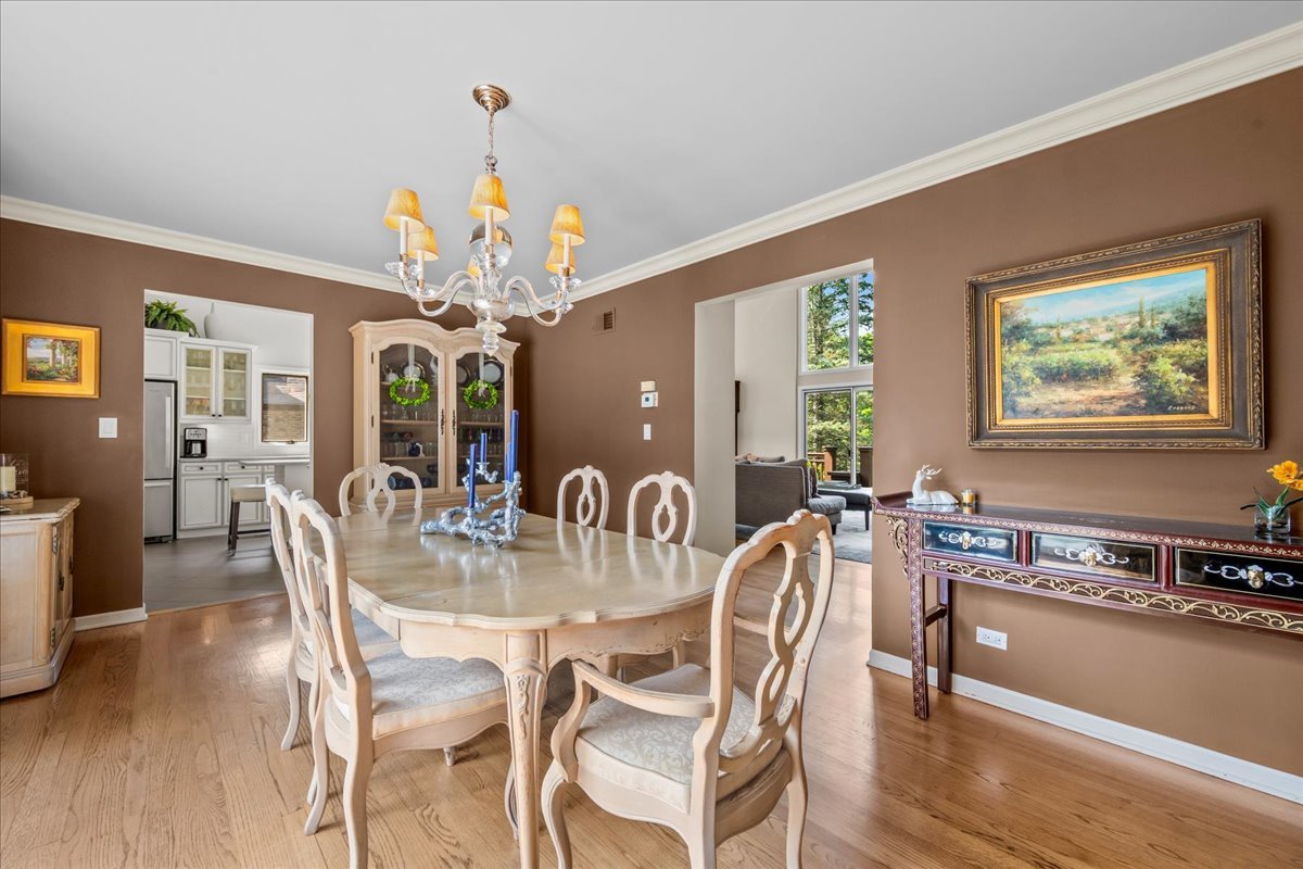 510 Buena Road Lake Forest, IL 60045 - Photo 14 of 40 a dining room with furniture a chandelier and wooden floor