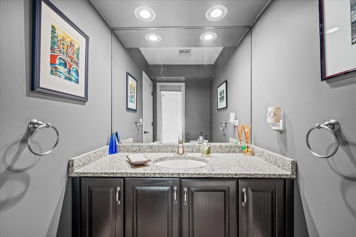 510 Buena Road Lake Forest, IL 60045 - Photo 15 of 40 a bathroom with sinks granite and a mirror