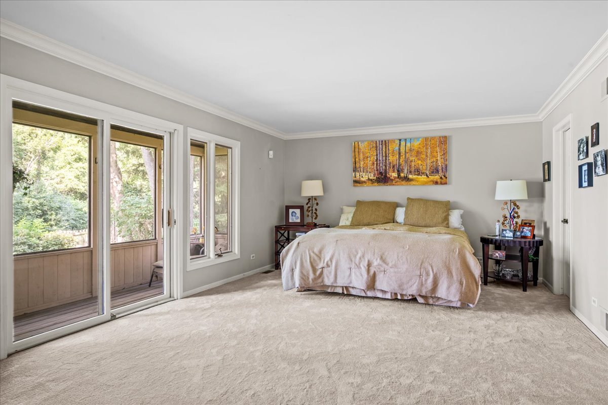 510 Buena Road Lake Forest, IL 60045 - Photo 16 of 40 a spacious bedroom with a bed and a large window