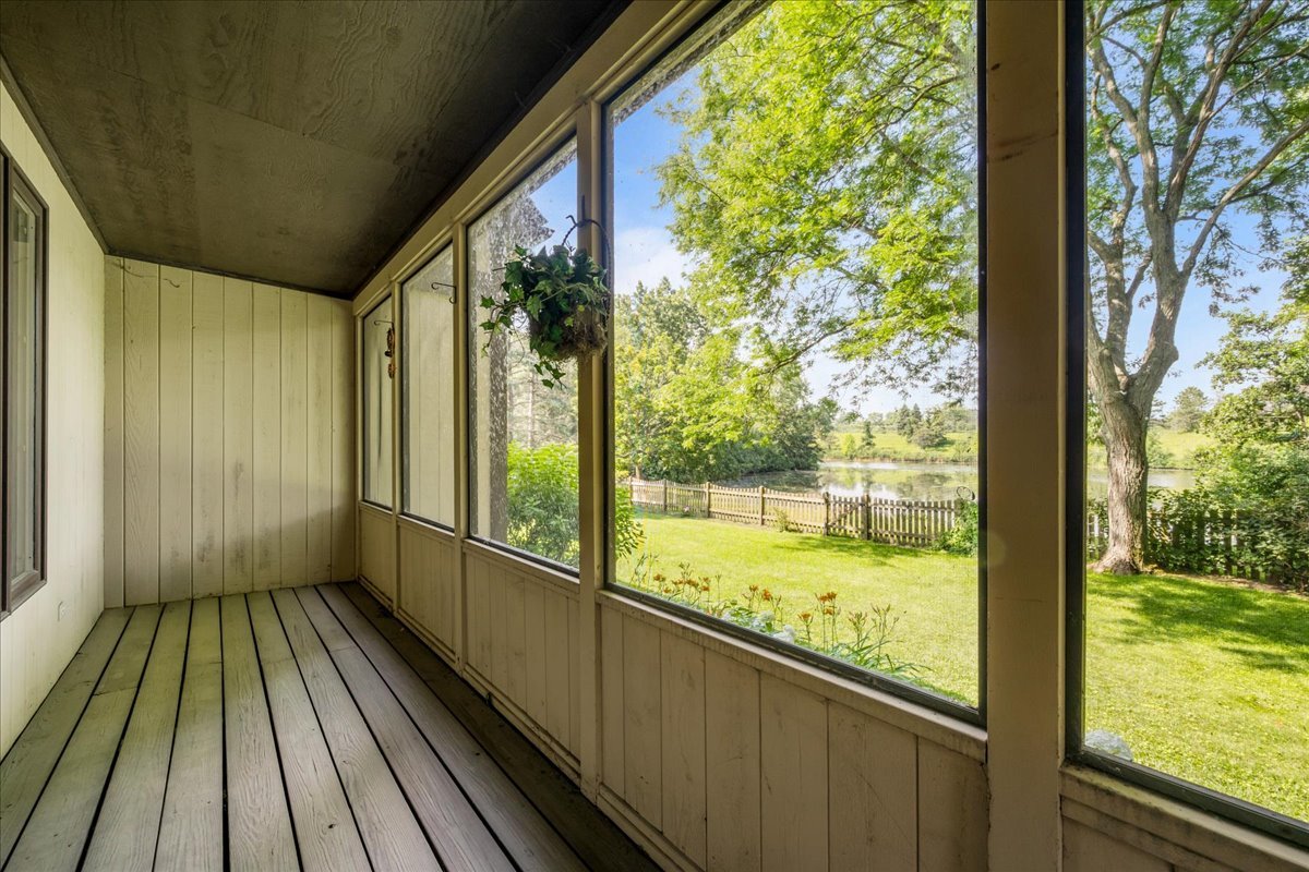 510 Buena Road Lake Forest, IL 60045 - Photo 17 of 40 a view of a room with wooden floor and iron stairs