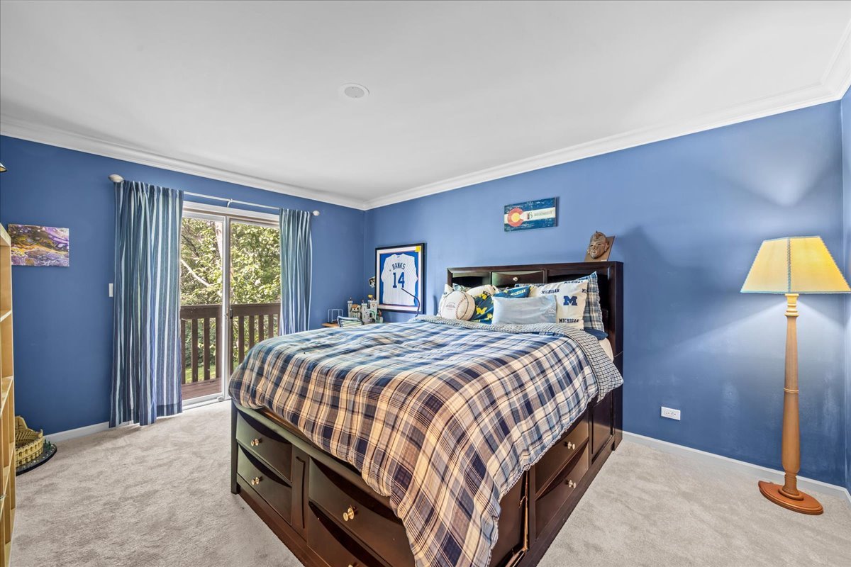 510 Buena Road Lake Forest, IL 60045 - Photo 24 of 40 a bedroom with a bed and a lamp next to a window