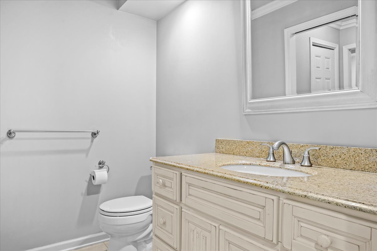 510 Buena Road Lake Forest, IL 60045 - Photo 28 of 40 a bathroom with a toilet sink and mirror