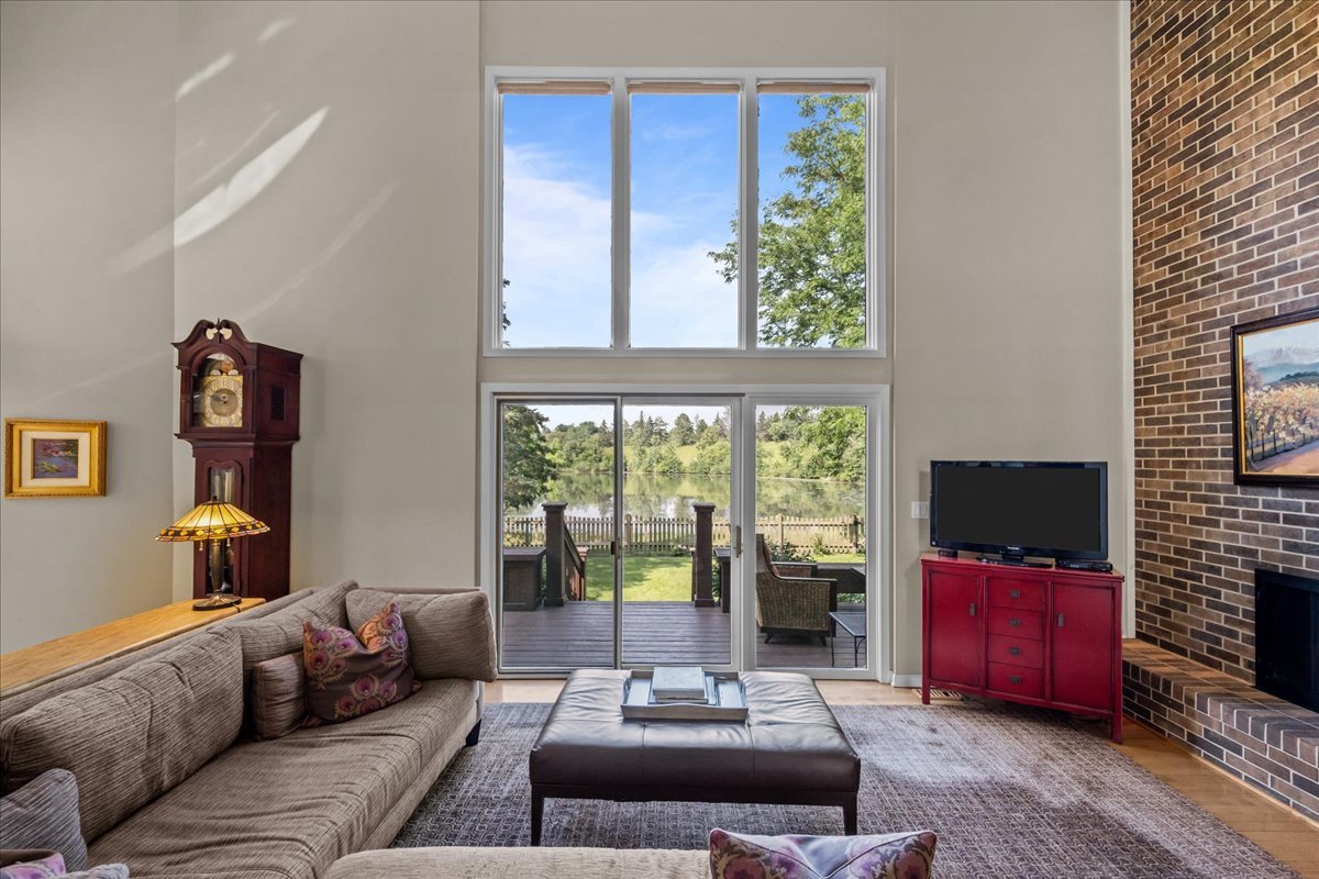 510 Buena Road Lake Forest, IL 60045 - Photo 8 of 40 a living room with furniture a flat screen tv and a large window