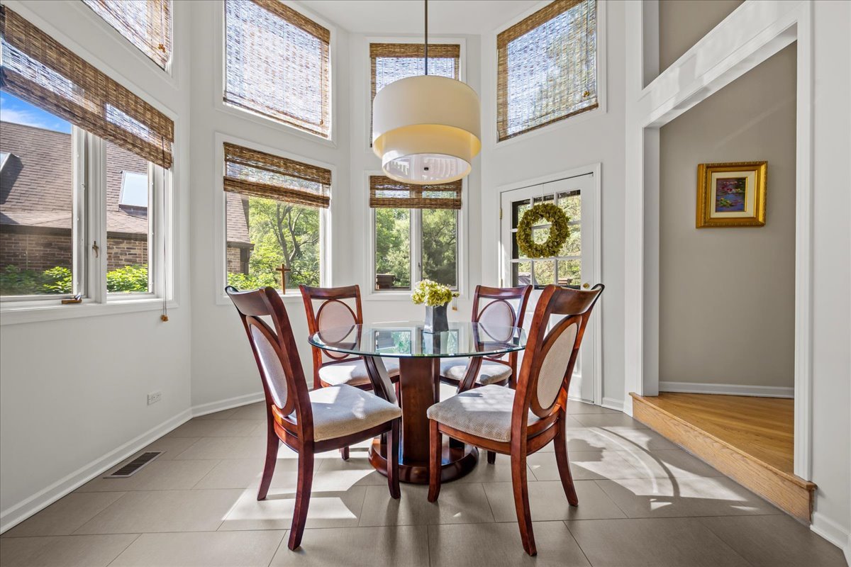 510 Buena Road Lake Forest, IL 60045 - Photo 10 of 40 a view of a dining room with furniture chandelier and wooden floor
