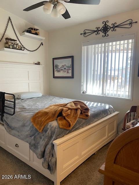 3700 South Tomahawk Road, Unit 59 Apache Junction, AZ 85119 - Photo 11 of 19 a bedroom with a bed and a window