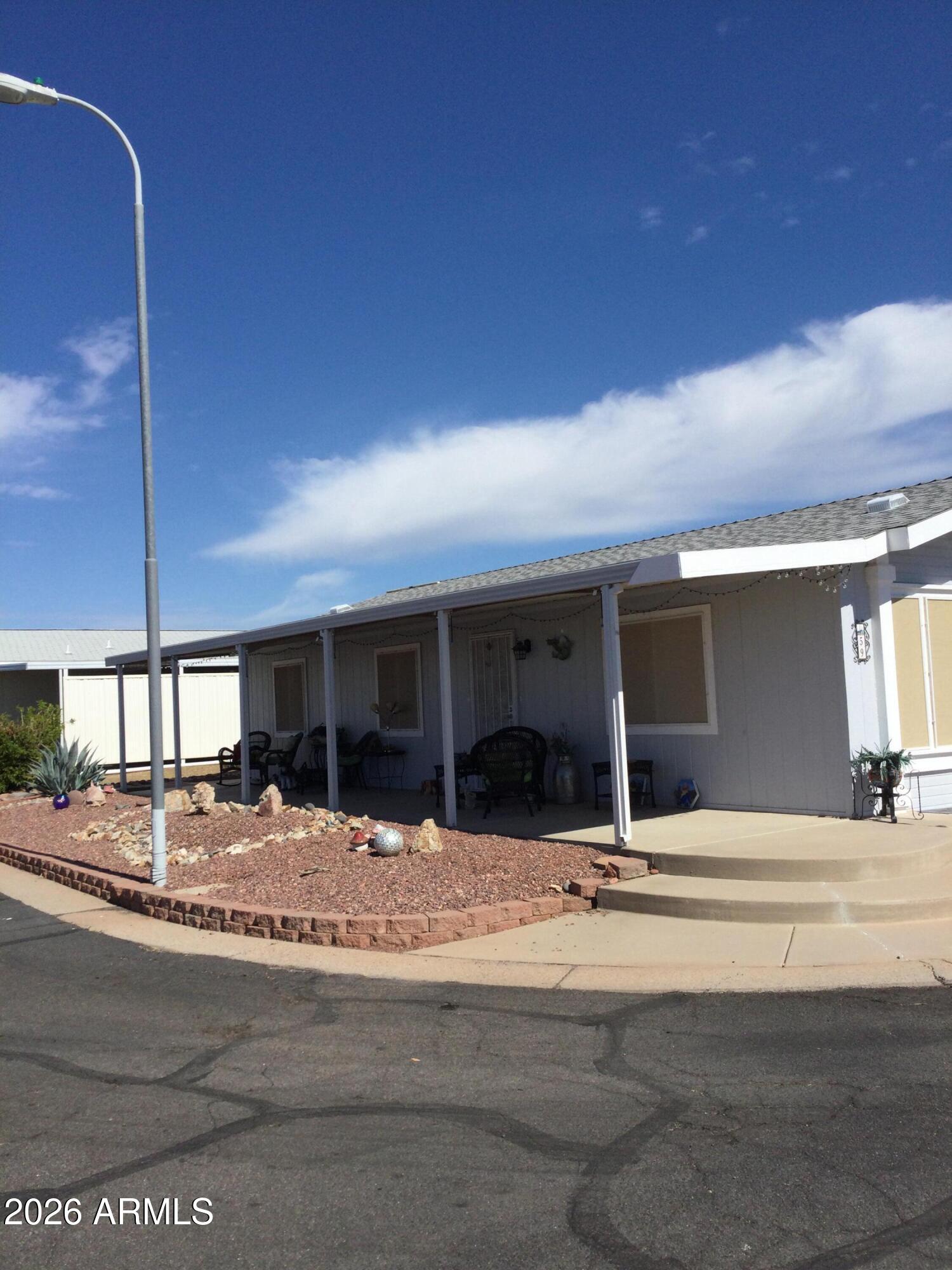 3700 South Tomahawk Road, Unit 59 Apache Junction, AZ 85119 - Photo 2 of 19 a view of living room and kitchen