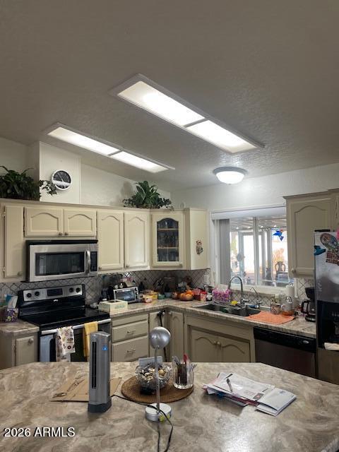 3700 South Tomahawk Road, Unit 59 Apache Junction, AZ 85119 - Photo 3 of 19 a kitchen with sink a stove and cabinets
