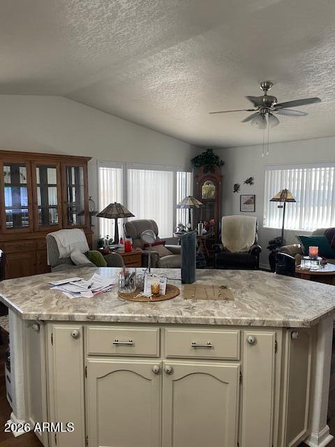 3700 South Tomahawk Road, Unit 59 Apache Junction, AZ 85119 - Photo 5 of 19 a kitchen with granite countertop a sink a counter top space appliances and cabinets