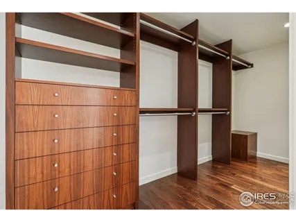 a view of an empty room with closet