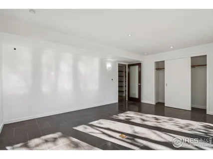 an aerial view of a house with a yard basket ball court and outdoor seating