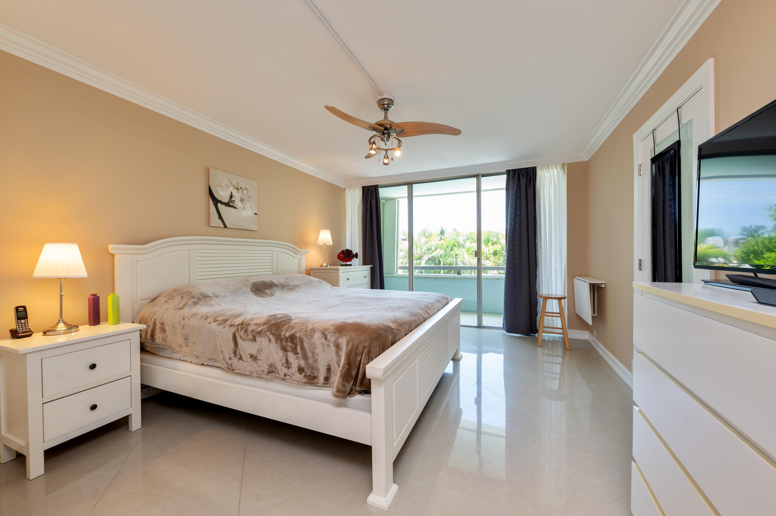 1112 Ocean Terrace, Unit 1B Delray Beach, FL 33483 - Photo 6 of 18 a bedroom with a bed and a large window