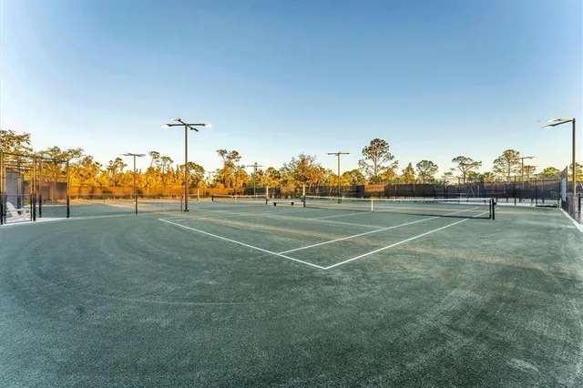 a view of an outdoor space and basketball court