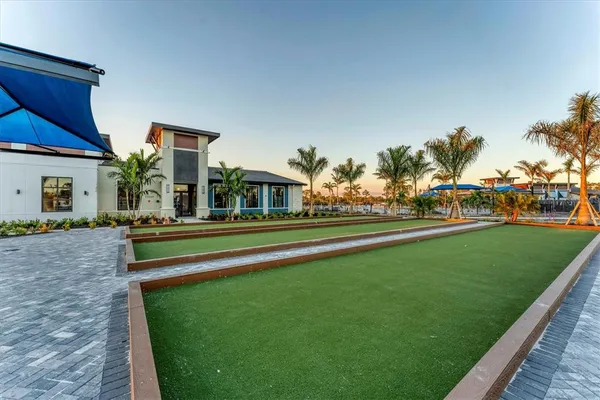 a view of a backyard with sitting area