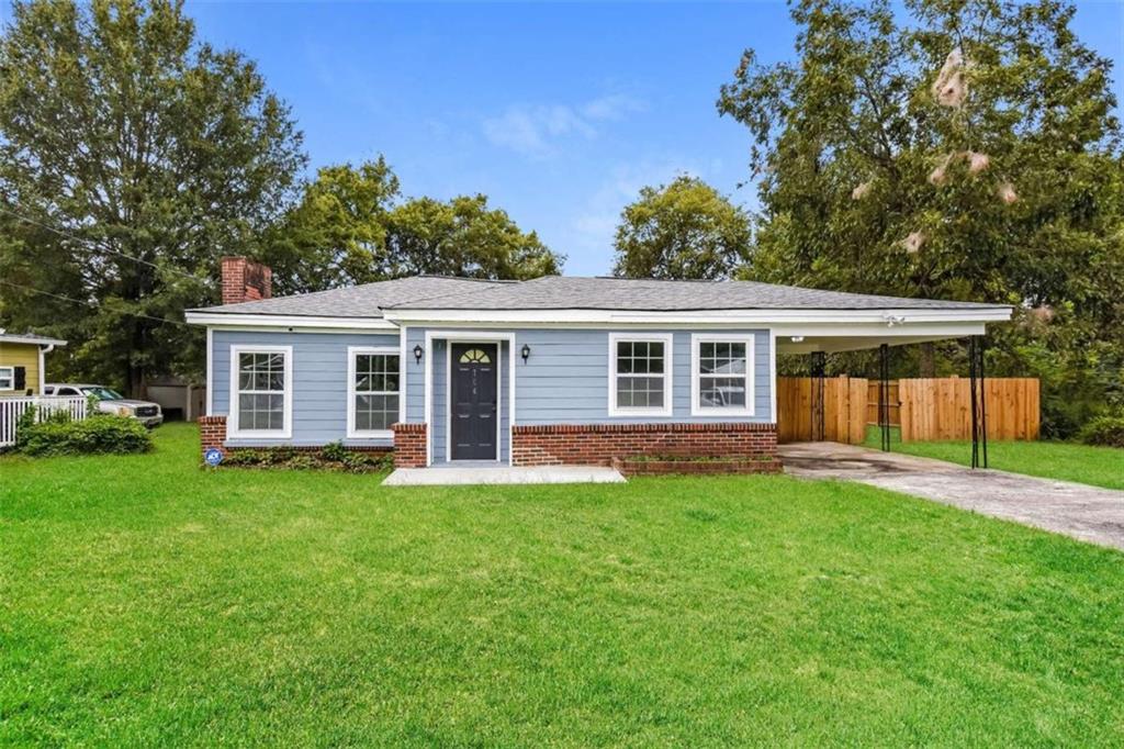 front view of a house with a yard