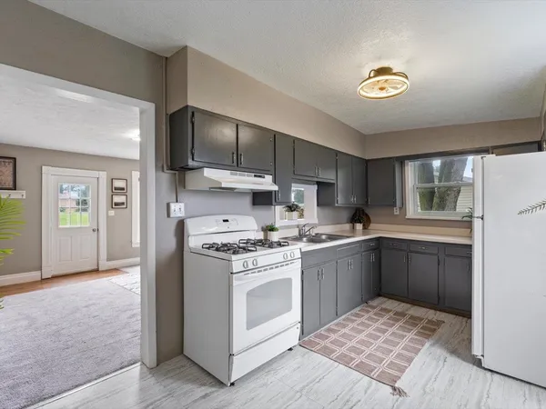 a kitchen with a stove and a sink