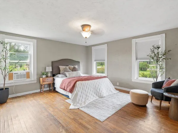 a bedroom with a large bed and a couch