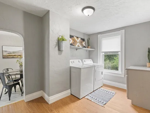 a utility room with sink dryer and washer