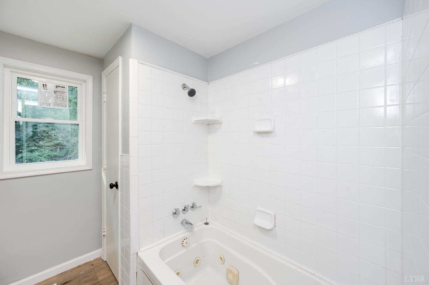 577 Thomas Road Madison Heights, VA 24572 - Photo 16 of 40 a bathroom with a tub and shower