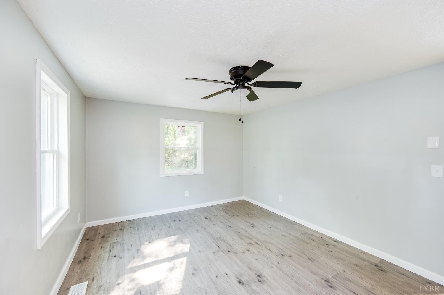 577 Thomas Road Madison Heights, VA 24572 - Photo 2 of 40 a view of a livingroom with a window and a ceiling fan