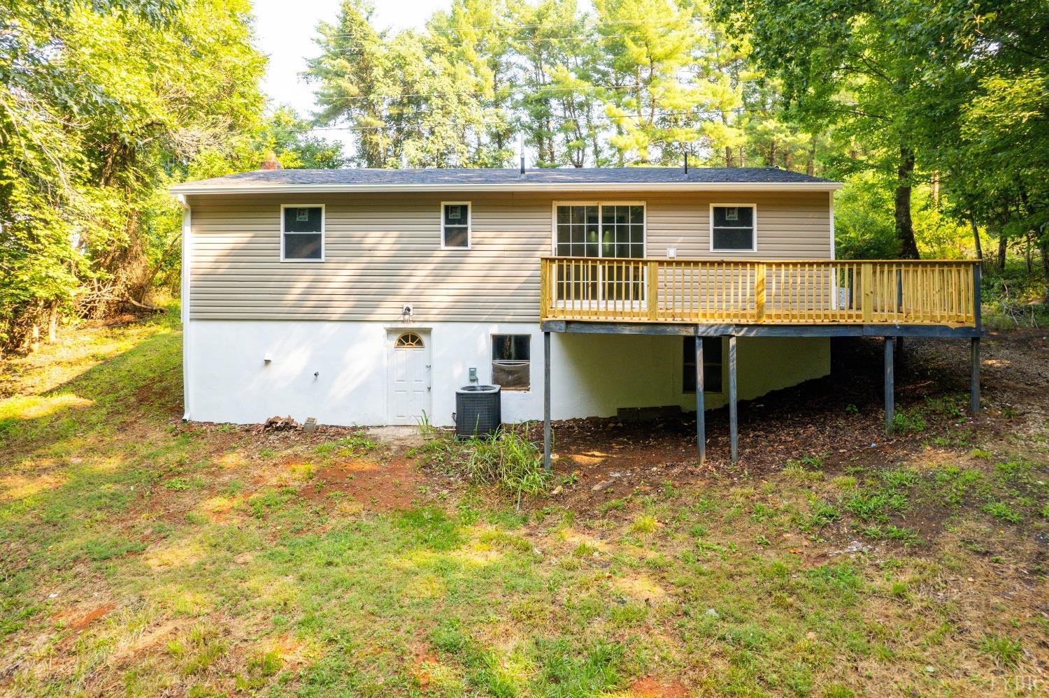 577 Thomas Road Madison Heights, VA 24572 - Photo 30 of 40 a view of a house with a yard and wooden fence