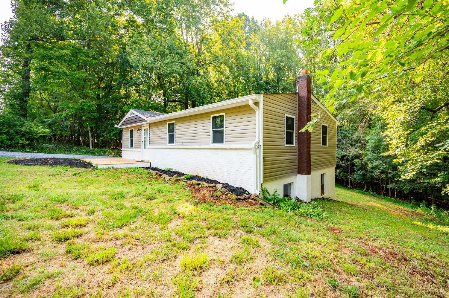 577 Thomas Road Madison Heights, VA 24572 - Photo 32 of 40 a front view of a house with garden