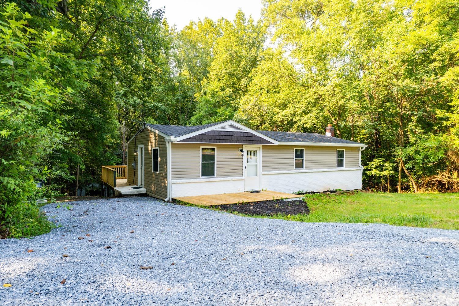 577 Thomas Road Madison Heights, VA 24572 - Photo 33 of 40 a front view of a house with a yard and garage