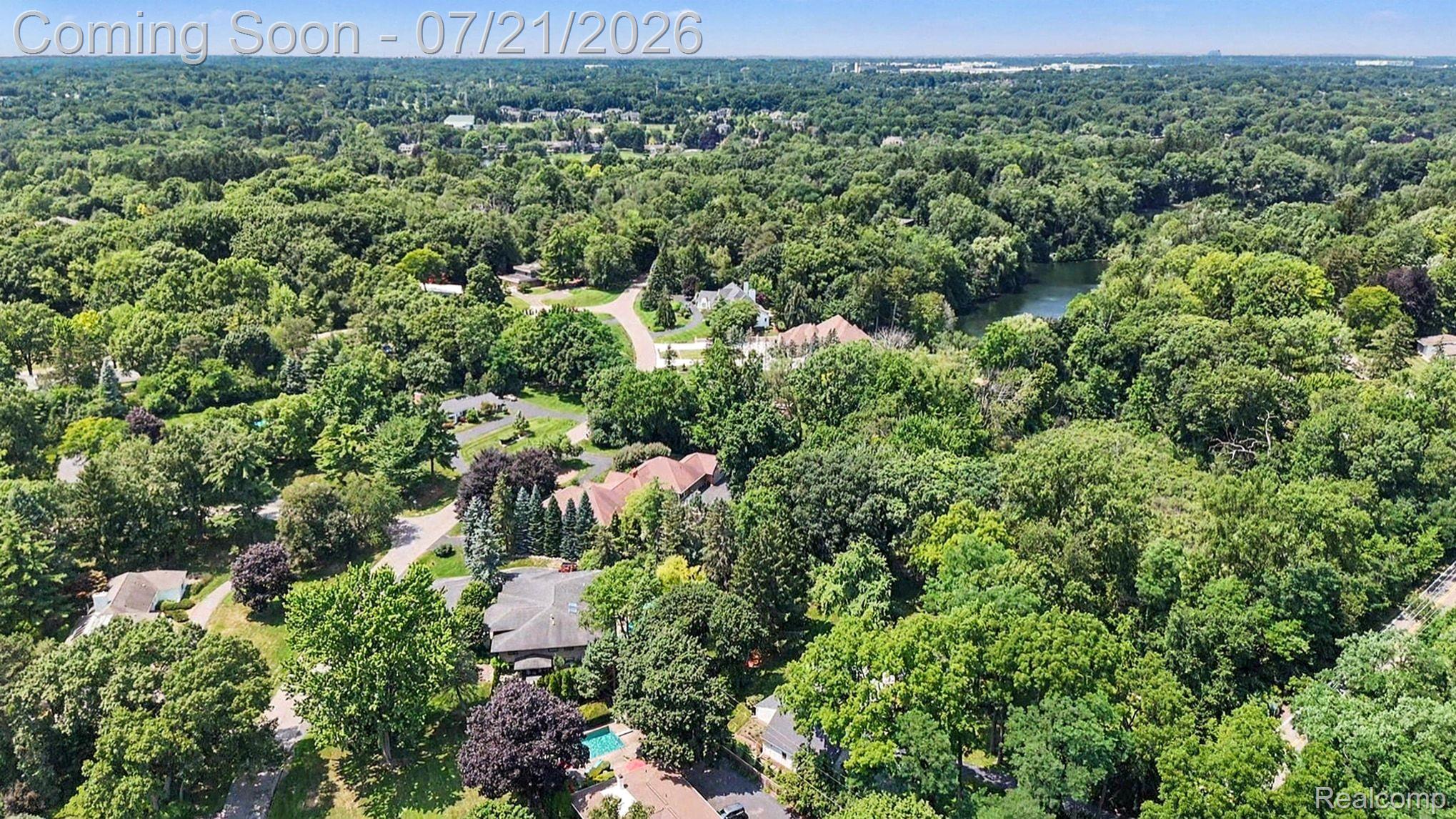 3780 Squirrel Road Bloomfield Hills, MI 48304 - Photo 54 of 59 Expansive aerial view showcasing a verdant, treed neighborhood with scattered residential properties