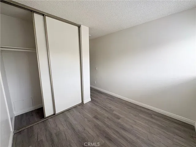 an empty room with wooden floor
