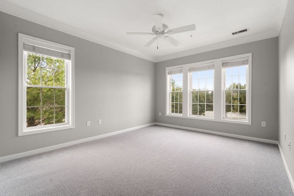 204 Clocktower Drive, Unit 206 Waltham, MA 02452 - Photo 16 of 27 a view of an empty room with a window