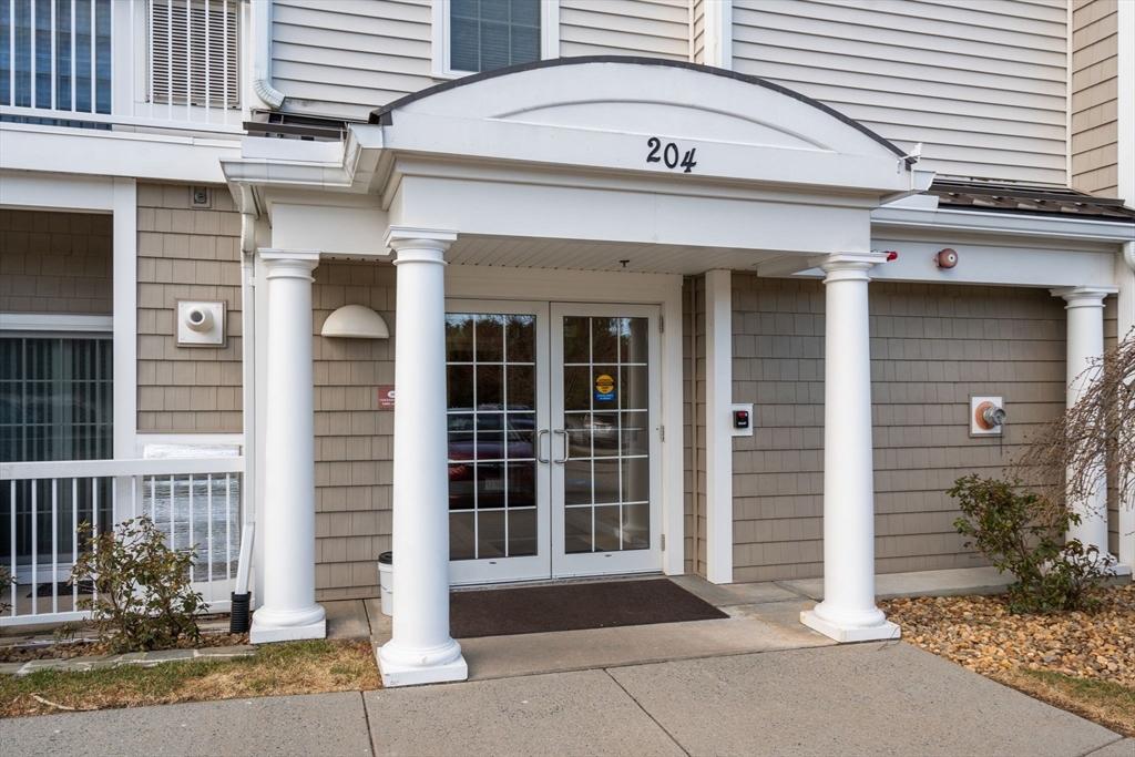 204 Clocktower Drive, Unit 206 Waltham, MA 02452 - Photo 2 of 27 a view of a house with a window