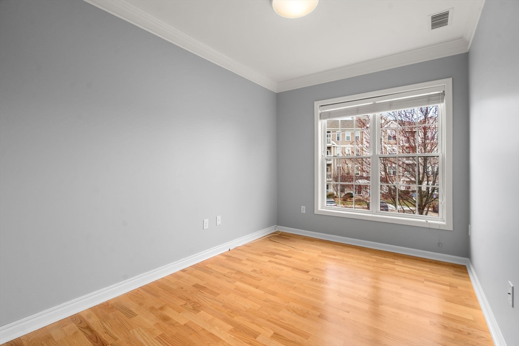 204 Clocktower Drive, Unit 206 Waltham, MA 02452 - Photo 23 of 27 an empty room with a window