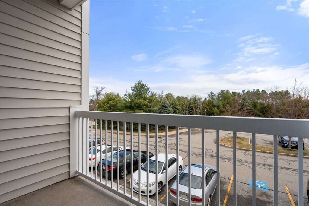 204 Clocktower Drive, Unit 206 Waltham, MA 02452 - Photo 25 of 27 a view of balcony with furniture