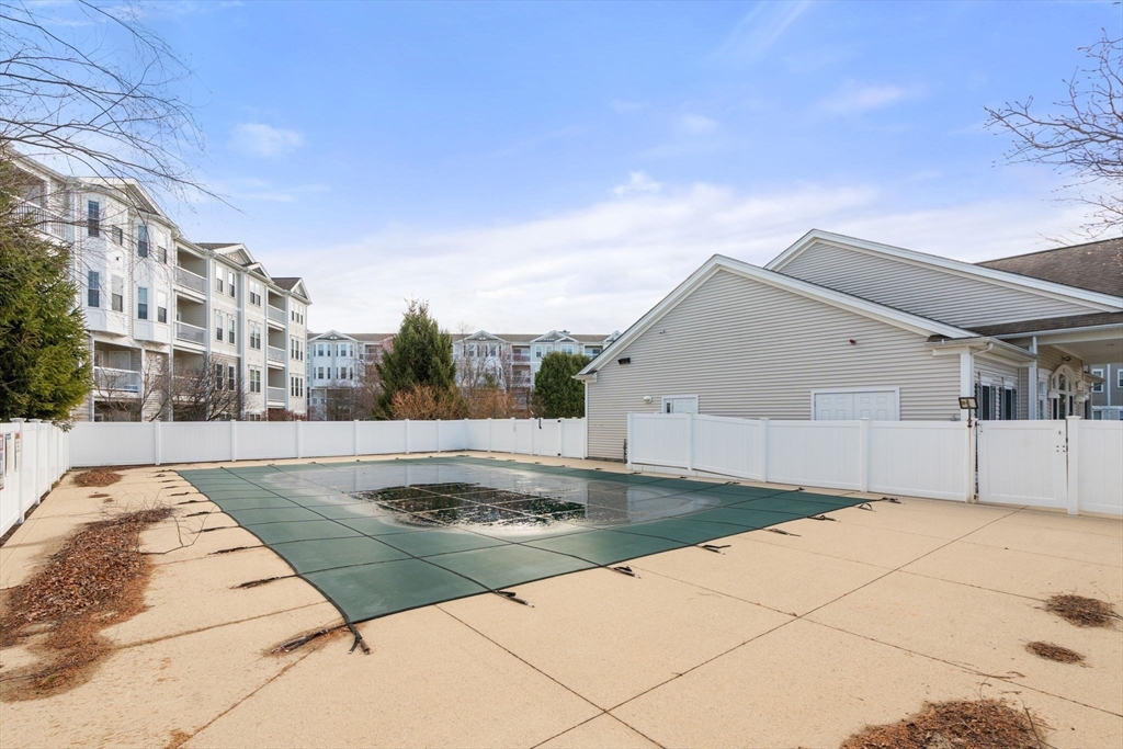 204 Clocktower Drive, Unit 206 Waltham, MA 02452 - Photo 26 of 27 a view of a house with pool