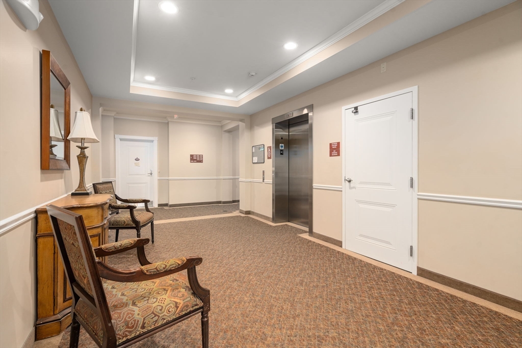 204 Clocktower Drive, Unit 206 Waltham, MA 02452 - Photo 5 of 27 a view of a livingroom with furniture