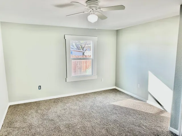 a view of a house with a yard and a garden