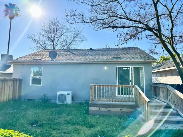 a view of a livingroom with an empty space and a window