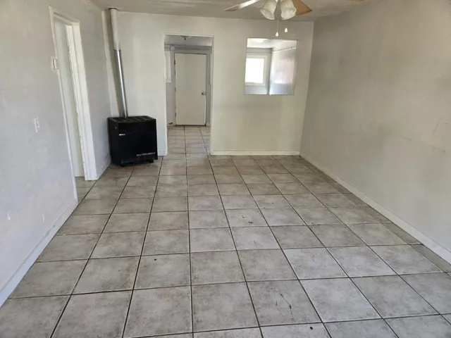 a view of an empty room with a window